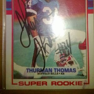 Thurman Thomas autographed Tops super rookie card and a Pete Metzilaars autograp
